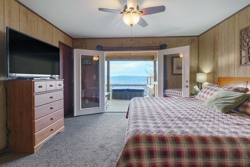 Bedroom with hot tub and views